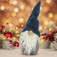 Decorative gnome with a blue hat and white beard on a white background