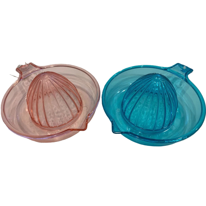 Two glass citrus reamers, one pink and one blue, on a white background.